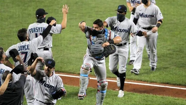 Retooled Marlins triumphant in return, beat Orioles 4-0