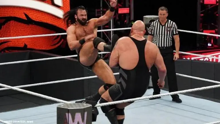 Newly crowned WWE Champion Drew McIntyre picks up The Big Show for a crushing body slam Drew McIntyre