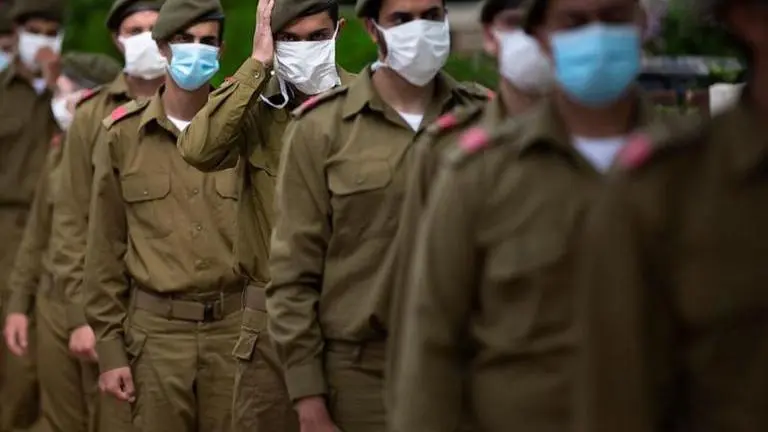 Israel marks memorial day under tightened virus restrictions