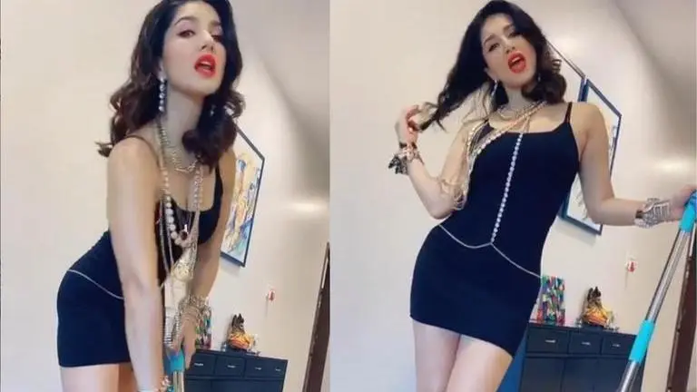 Sunny Leone gives a glamorous twist to doing household chores; watch sunny leone