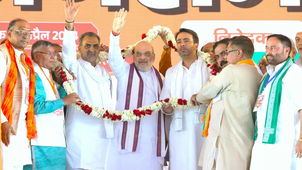 Union Home Minister Amit Shah with Muzzafarnagar candidate Sanjeev Balyan and RLD chief Jayant Choudhary during a rally