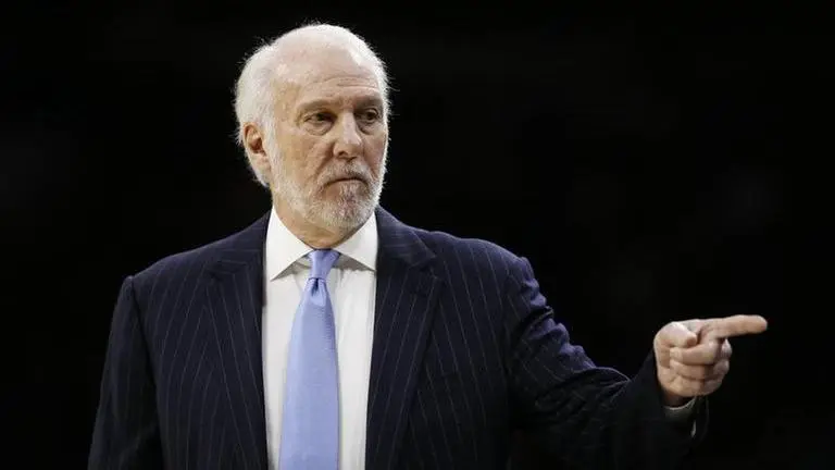 Masked man: Spurs’ Popovich wears face covering for game