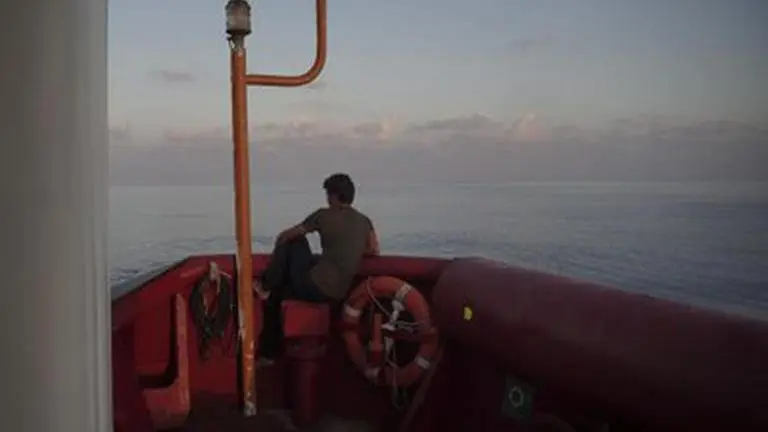 Italy: 70 migrants on ship awaiting OK to land jump into sea