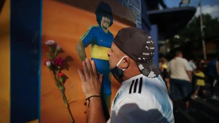 Thousands mourn as Maradona is buried in Buenos Aires