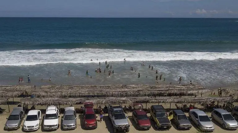 Venezuelans head back to beach as lockdown relaxed