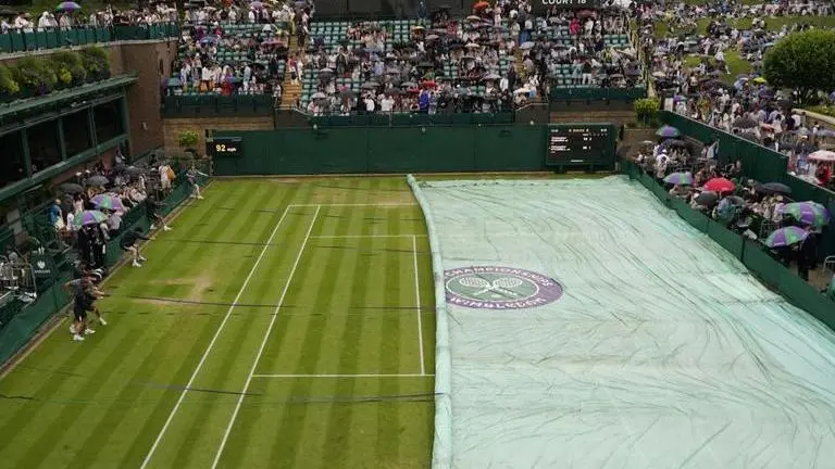 The rain returns to Wimbledon on Day 6 of the grass-court Grand Slam tournament The rain returns to Wimbledon on Day 6 of the grass-court Grand Slam tournament