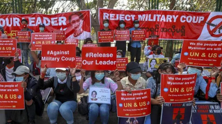 Image shows 'We Want Democracy' mural in Myanmar