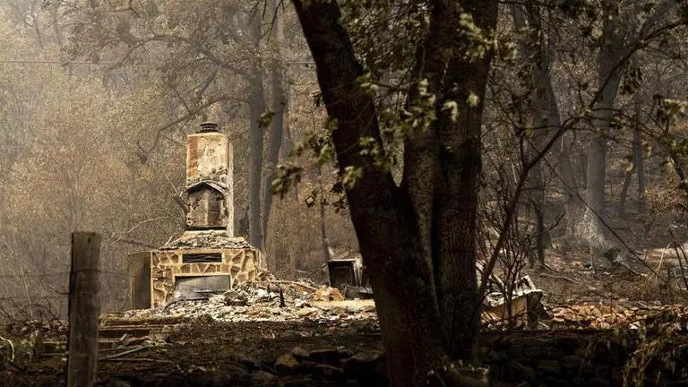Deadly California wildfire wipes out scenic river town