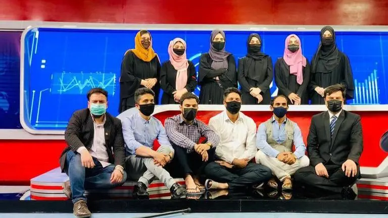 Male anchors in Afghanistan don masks after Taliban orders women to cover faces on TV Afghanistan TV anchors cover faces