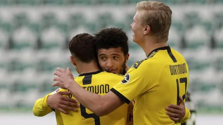 No fans, but Dortmund keeps Bundesliga title challenge alive No fans, but Dortmund keeps Bundesliga title challenge alive