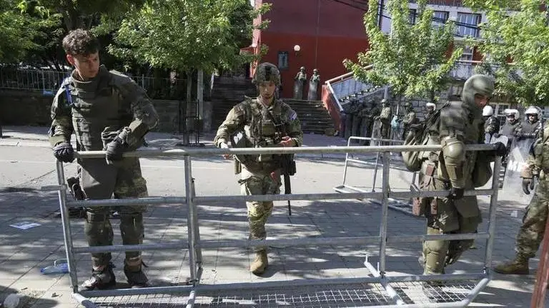 NATO's secretary-general says 700 more troops sent to Kosovo to help deal with protests KFOR NATO troops