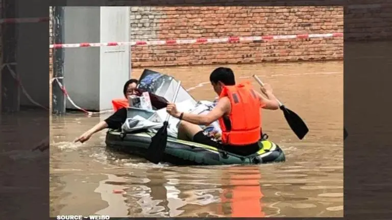 A woman stuck in China floods saves husband's Gundam collection first woman