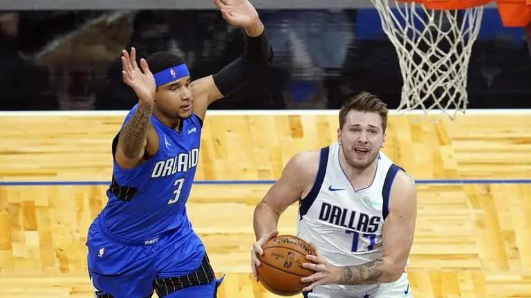 Doncic scores 33, leads Mavericks past Magic 130-124