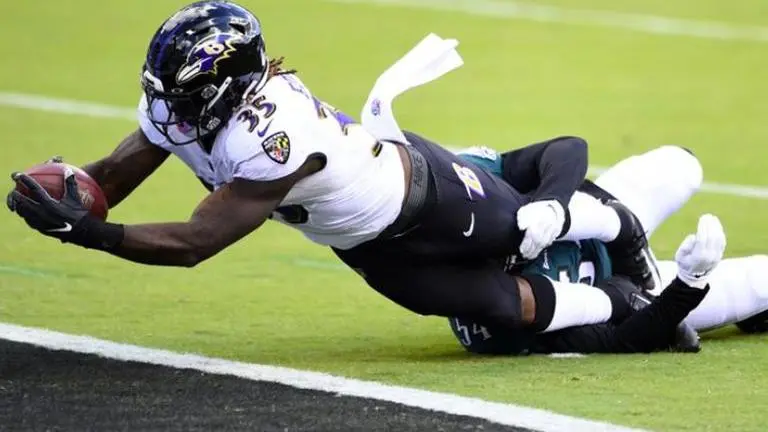 Ravens hold on for 30-28 win over depleted Eagles