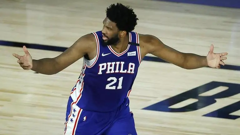 Harris, Embiid lead 76ers past Magic 108-101