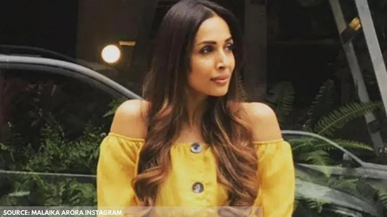 Malaika Arora snapped in red gym wear as she is spotted in Bandra after workout Malaika Arora