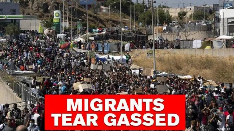 Moria migrants clash with local police while protesting over new camp, face tear gas Moria Migrants: Protesters demanding 'freedom' tear gassed by police