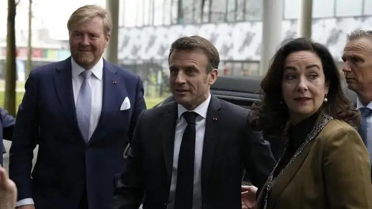 Police detain protester as French President Macron visits Amsterdam university Macron