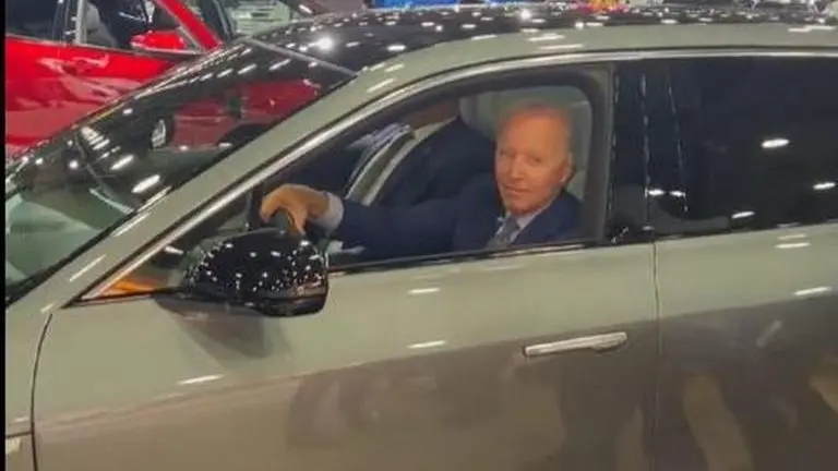 Biden calls himself a 'car guy', offers ride on luxury EV to journalists during auto show joe biden