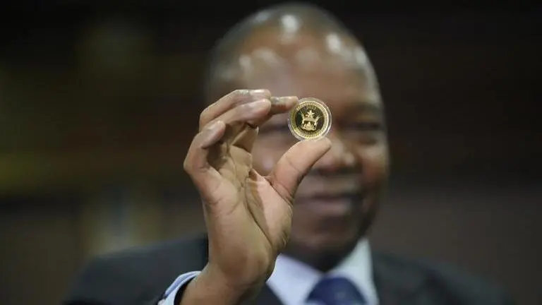 Zimbabwe debuts gold coins as legal tender to stem inflation Zimbabwe gold coin