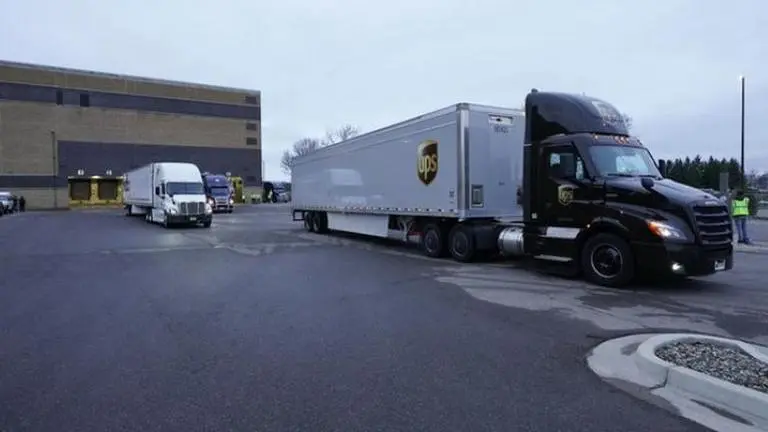Trucks leave to distribute virus vaccine around US