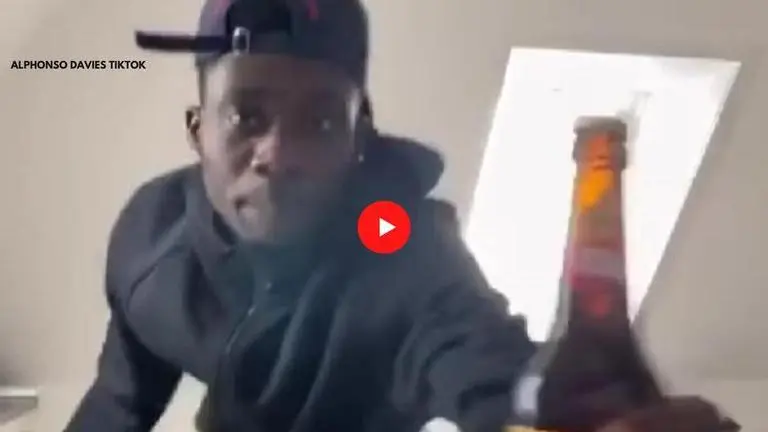 Bayern Munich's Alphonso Davies celebrates hysterically after opening bottle with a knife Bayern Munich