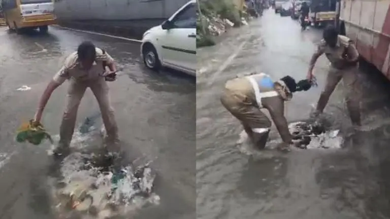 Hyderabad cop cleans clogged drain causing waterlogging, earns netizens' praise Hyderabad cop clears drain causing traffic disruption, earns netizens' praise