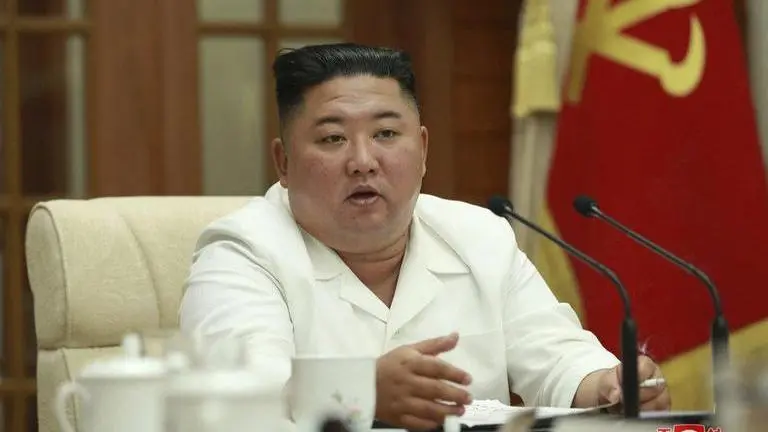 North Korean state media shows Kim Jong Un at meeting after 'comatose' claims North Korean