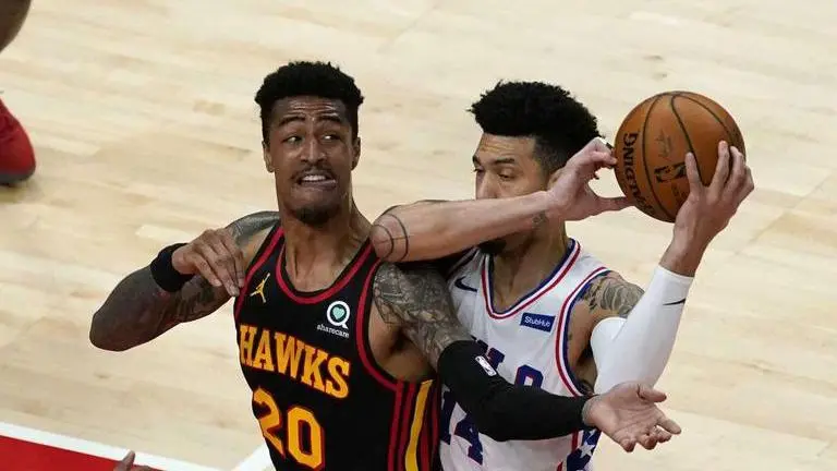 Young's 26 points lead Hawks past short-handed 76ers, 112-94
