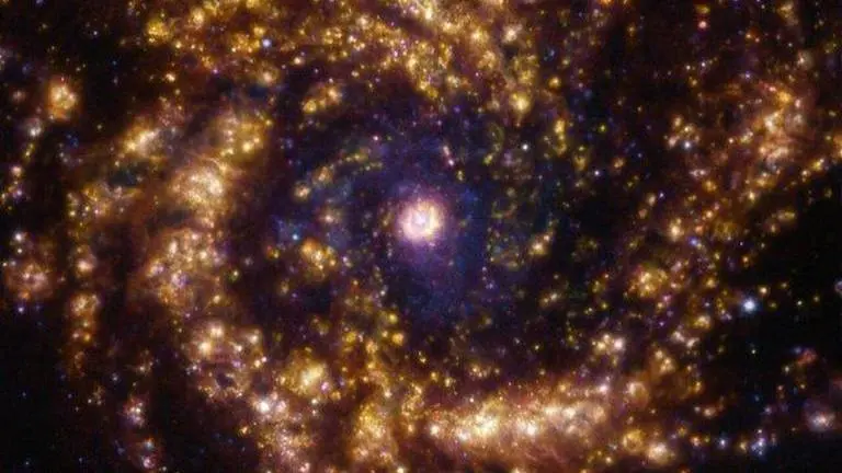 ESO shares new image of golden starburst galaxy brimming with newly formed stars ESO