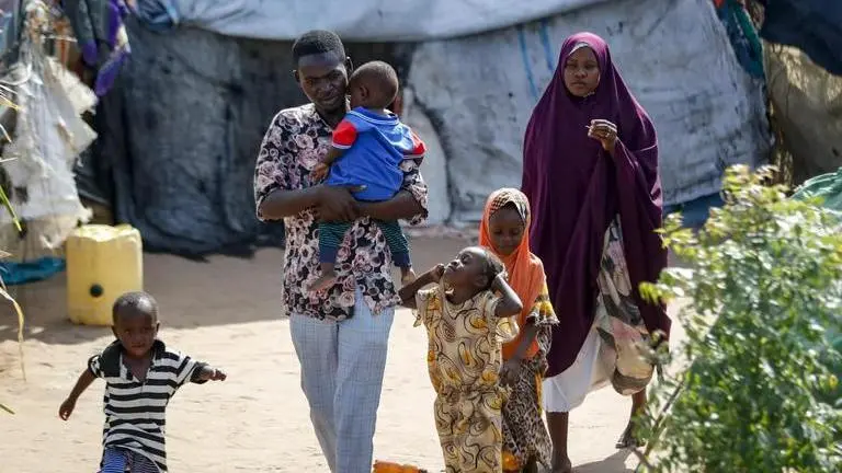 In Kenya, food scarcity in refugee camps leave children hungry even before the green deal Abdikadir Omar walks to a shelter with his wife and children, who made a 12-day journey from Somalia in search of food and safety