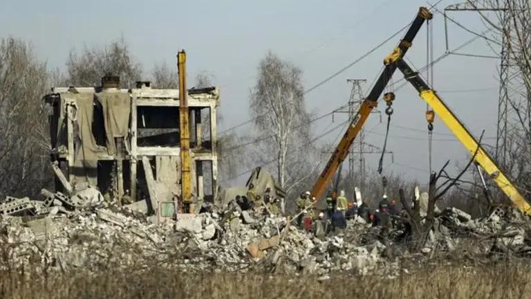 Massive use of phone by soldiers reason behind deadly missile attack by Ukraine: Russia Workers clean rubbles after Ukrainian rocket strike in Makiivka
