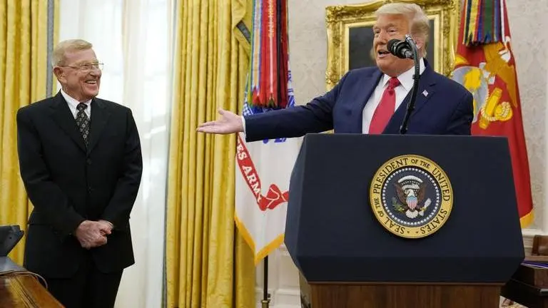 Donald Trump honours coach Holtz as 'one of the greatest'