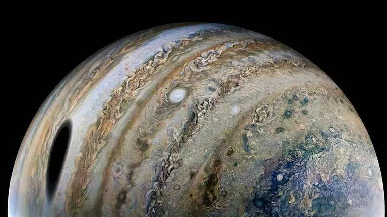 NASA's Juno beams back another stunning Jupiter pic shadowed by its Moon Ganymede NASA