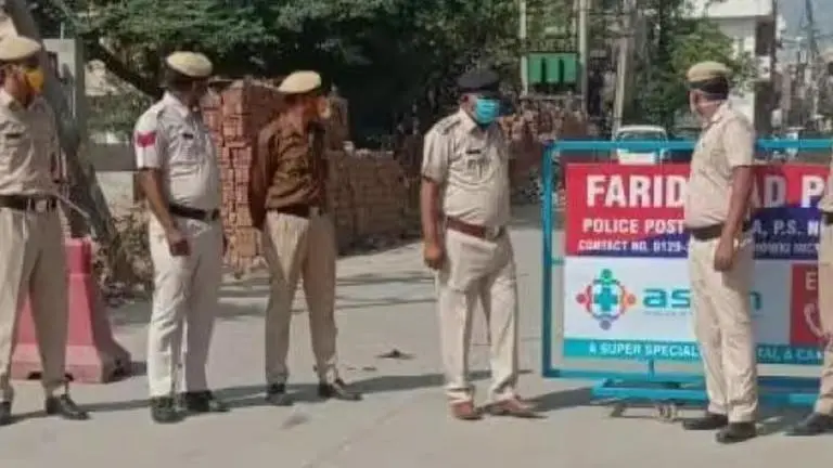 Woman climbs electric pole, claims police implicating husband, sons Faridabad Police