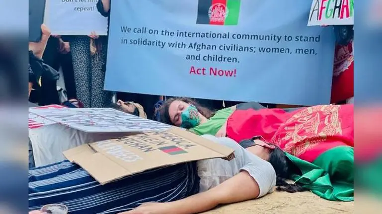 Afghan families, women protest outside London's Parliament square against Taliban takeover Afghan Families