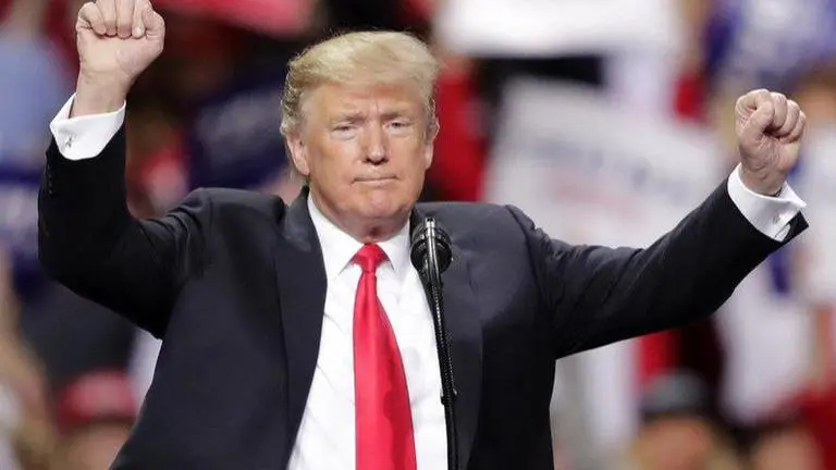 Texas man accused of punch amid Trump argument turns self in