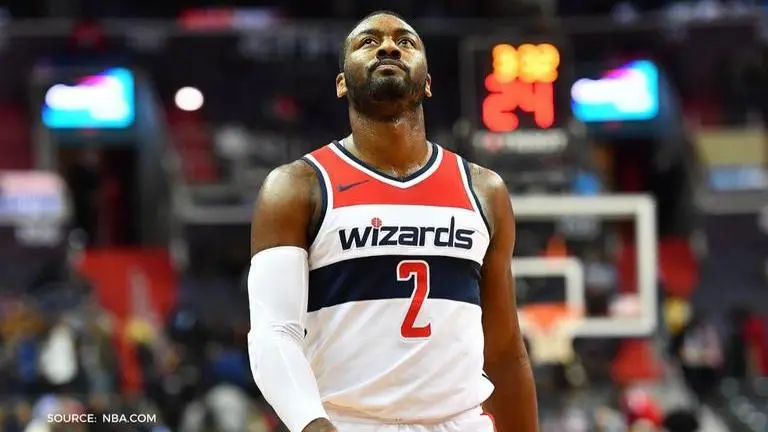 John Wall apologises after partying and throwing up gang signs in a viral video John Wall