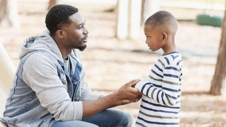 How managing anger in kids can make parents more mature and sorted Father pacifying a child