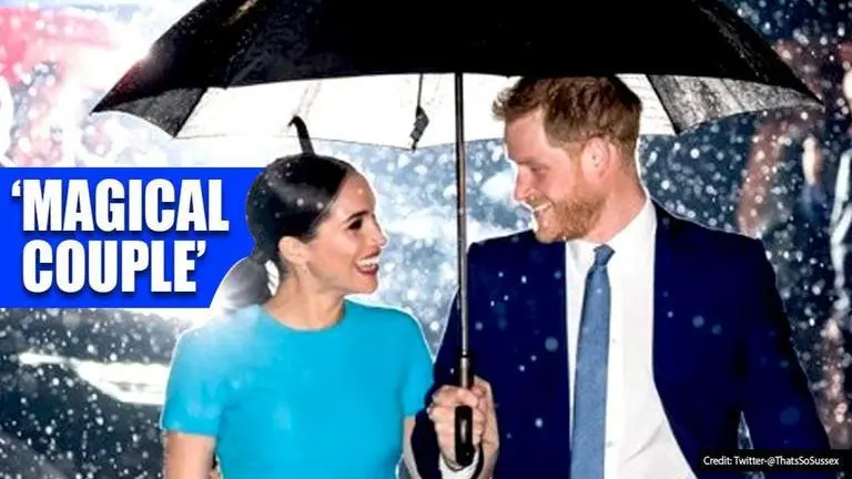 Harry and Meghan look 'cinematically gorgeous' as they share an umbrella in rain Harry