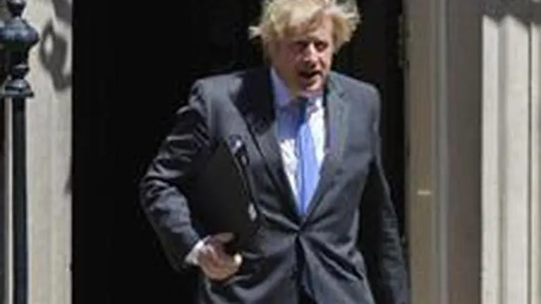 Candle lit outside 10 Downing Street for virus victims