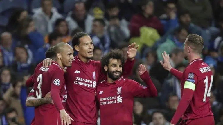 Liverpool players celebrate together after being crowned Premier League Champions liverpool