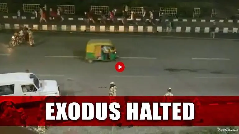 WATCH: Migrant exodus from Delhi to UP stopped at Ghazipur; Police asks them to return COVID-19