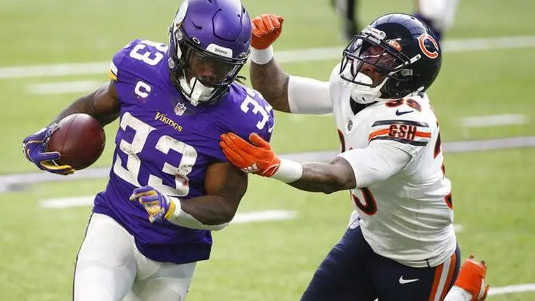AP sources: Star Vikings RB Cook absent after father's death