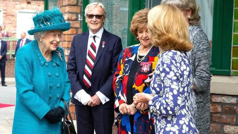 Queen visits set of world's longest running TV soap Coronation Street on 60th anniversary Coronation Street