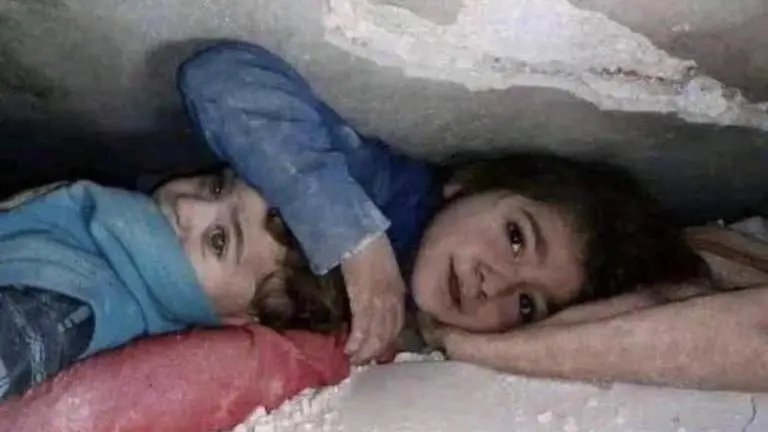 Picture of 7-year-old girl protecting brother under debris after quake in Syria goes viral Syria earthquake