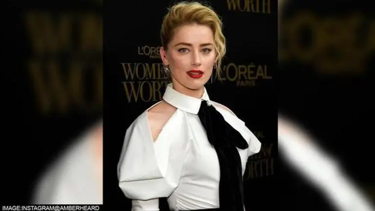 Amber Heard shops at discount store post defamation verdict; netizens say 'it's staged' Amber Heard