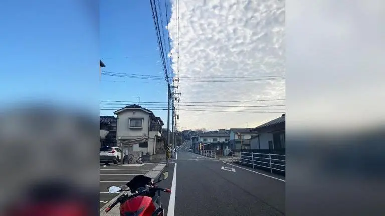 Linear cloud formation in Japan divides city into blue and grey skies; Netizens wowed Japan