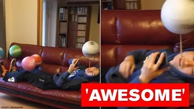 Man spins 5 footballs while lying on couch without using hands, netizens amazed | Watch spinning 5 footballs