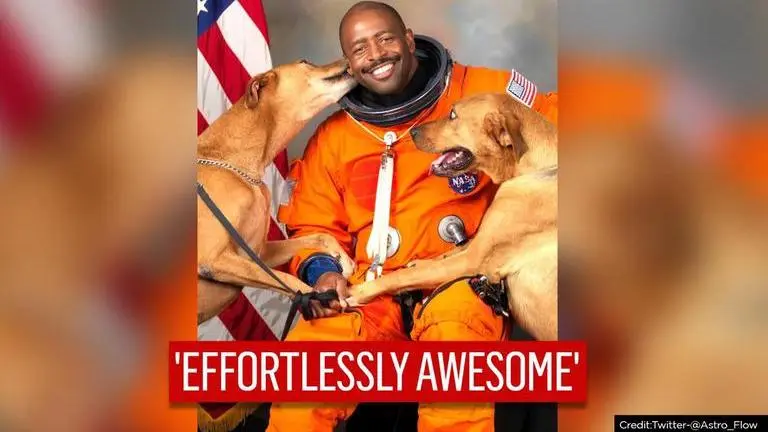 Former NASA astronaut’s 'iconic portrait' with two rescue dogs wins internet NASA